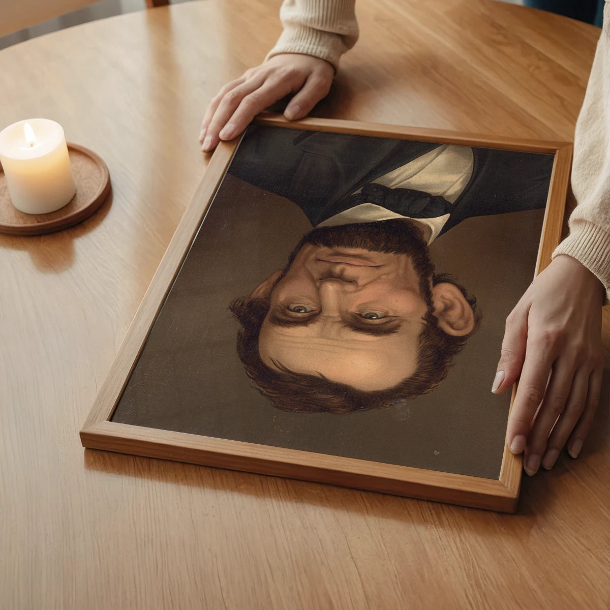 The print of a bearded man in a bow tie in a bedroom setting