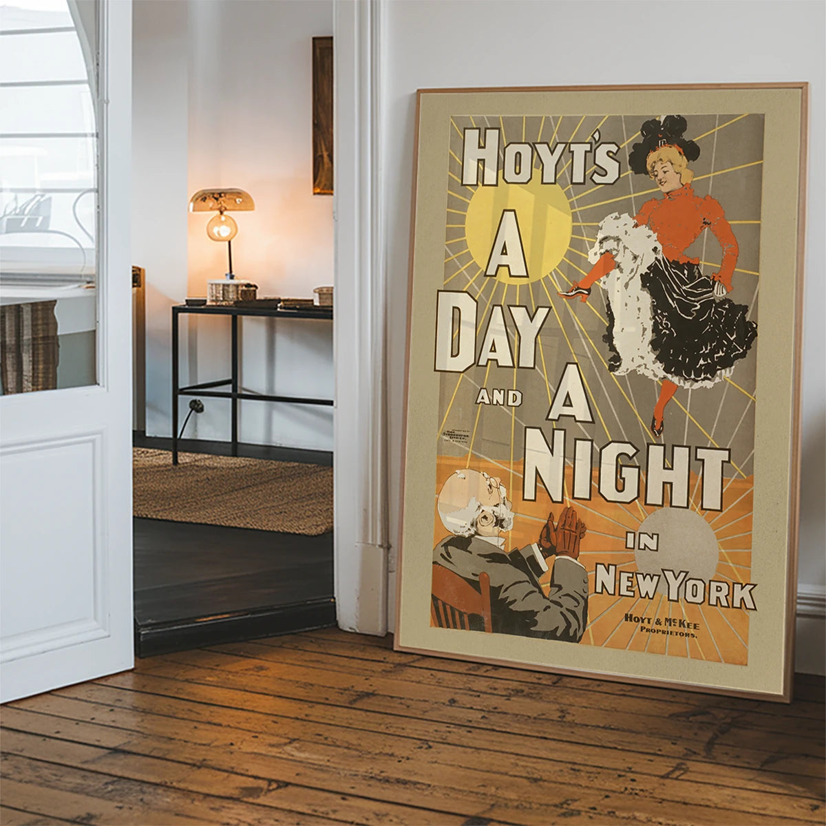 Retro 1898 stage poster artwork hung in a hallway