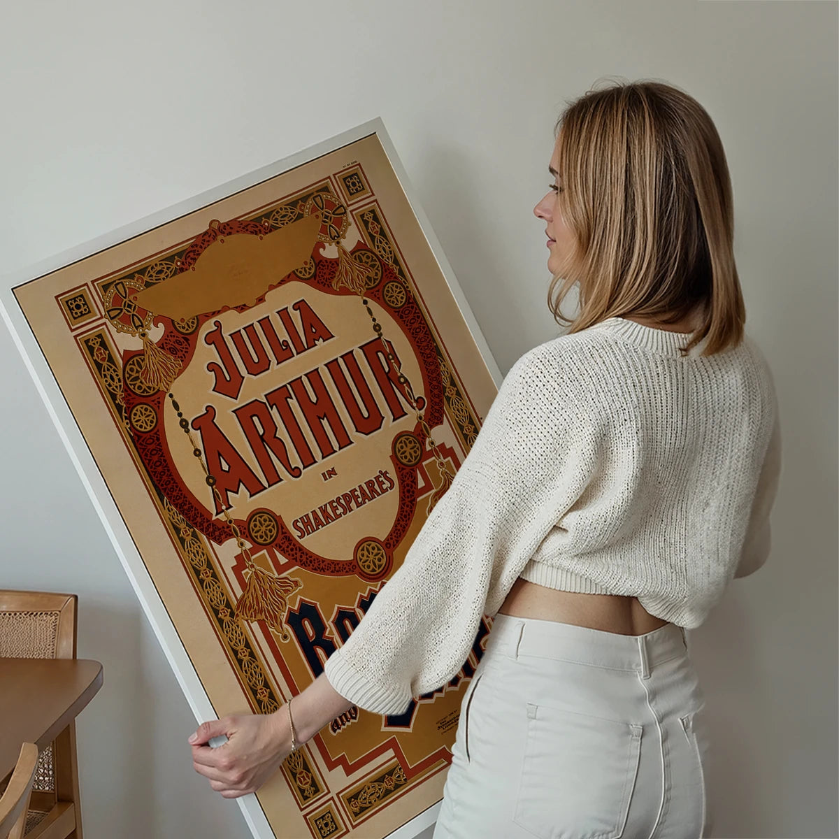 Romeo and Juliet vintage theatre poster print displayed on a living room wall