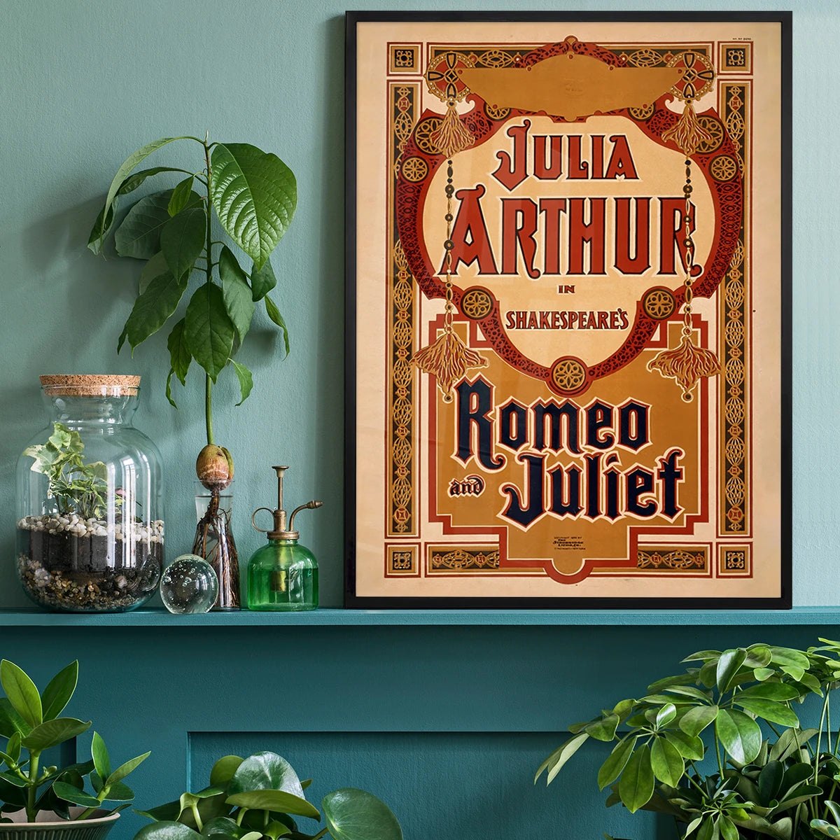 Vintage Shakespeare theatre poster in red, gold and navy on a home office wall