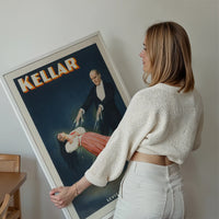 Kellar magician poster as vintage levitation wall art above a sofa in a living room