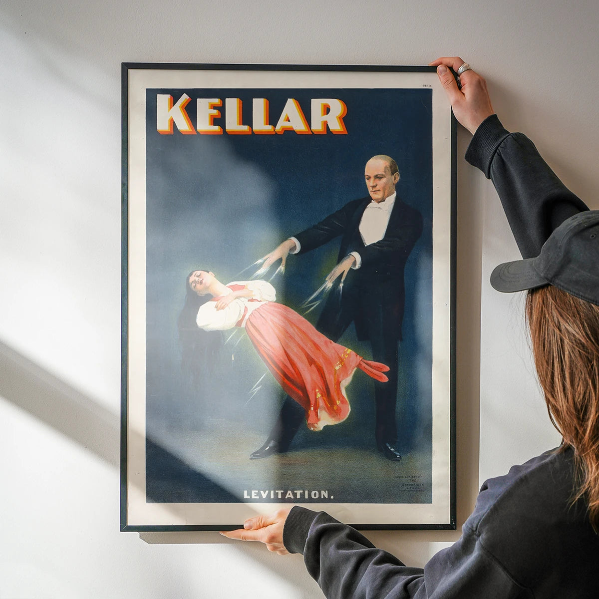 Kellar Levitation print brightening a kitchen wall with retro showman style