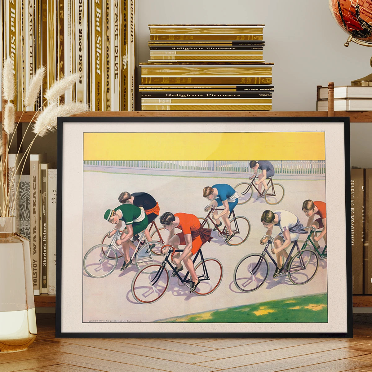 Vintage cycle racers print displayed on a living room wall above a sofa