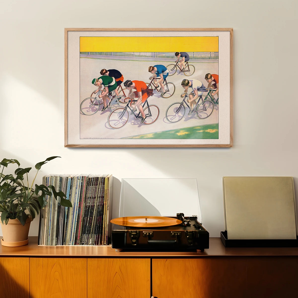 Seven Bicyclists Racing vintage cycling print hung in a hallway