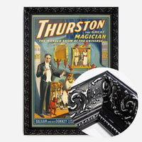 vintage magician theatre poster print in a black ornate frame, side profile