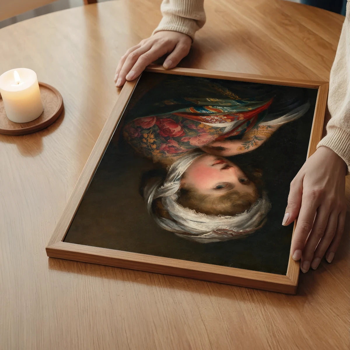 The print of a woman in a floral shawl styled in a calm bedroom