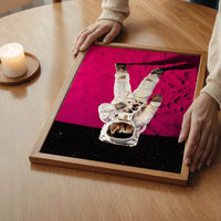 Astronaut on pink moon wall art in a bedroom, a striking space-themed statement piece