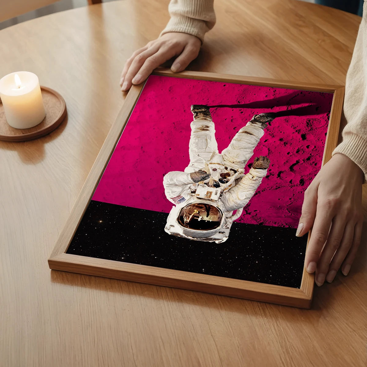 Astronaut on pink moon wall art in a bedroom, a striking space-themed statement piece