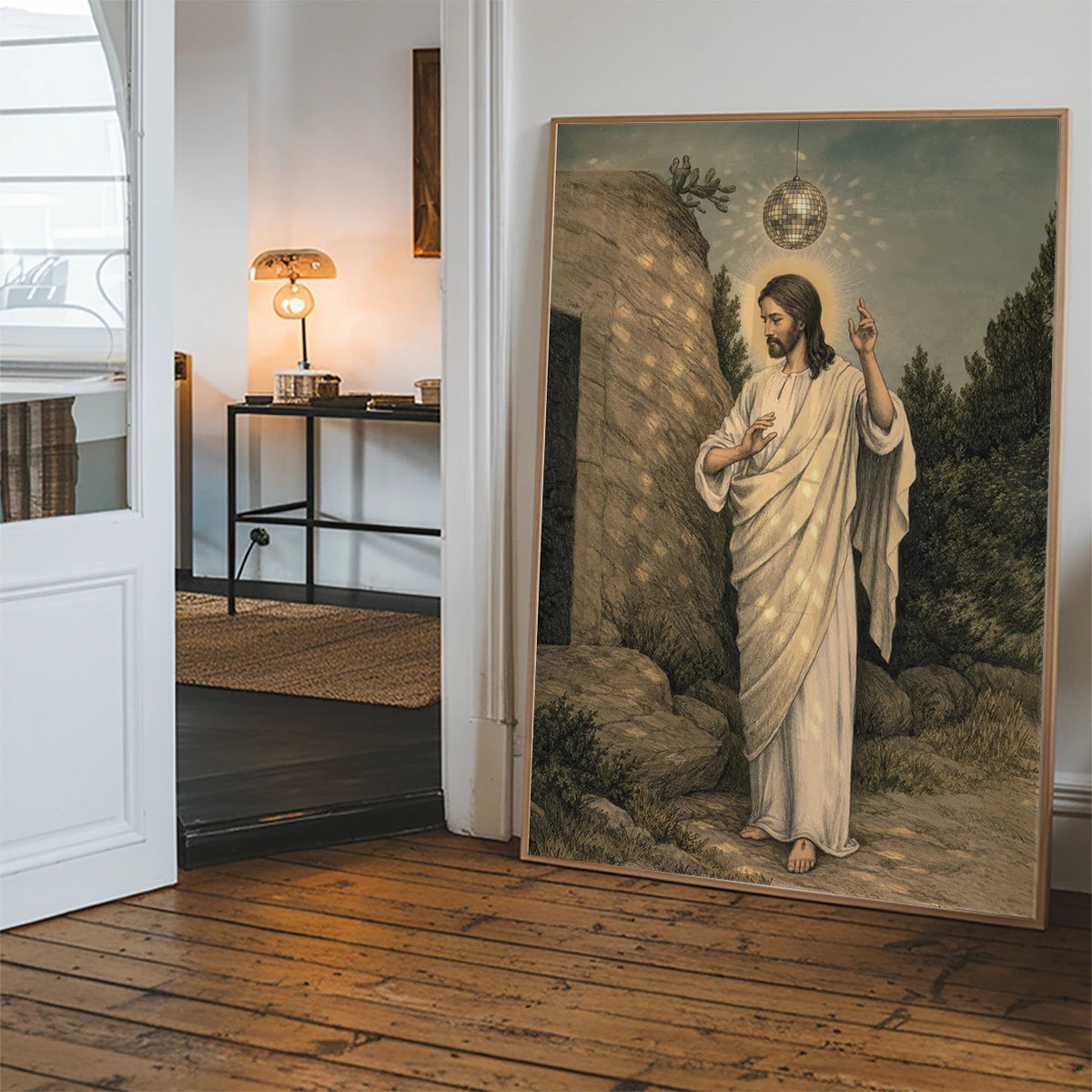 The print of a robed figure under a mirror ball in a hallway
