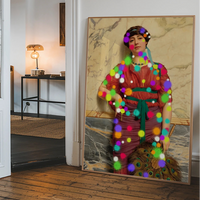 Splattered classical lady portrait hanging in a hallway as a bold altered art statement