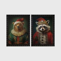 Set of 2 framed prints, animals in festive Christmas dress: a bear in a festive green and gold robe with a fur-trimmed hat; and a raccoon in a festive red robe with a crown hat — unframed