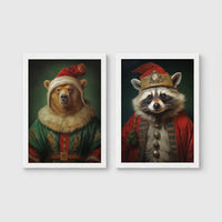 Set of 2 framed prints, animals in festive Christmas dress: a bear in a festive green and gold robe with a fur-trimmed hat; and a raccoon in a festive red robe with a crown hat — unframed