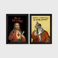 Set of 2 framed prints, festive prints: a "Merry Christmas" print with a classical Sacred Heart image; and a "Merry Christmas Ya Filthy Animal!" illustrated Santa print — unframed