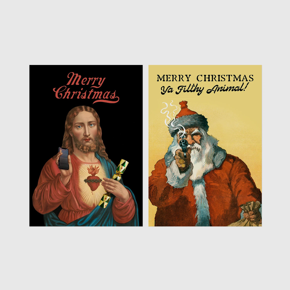 Set of 2 framed prints, festive prints: a "Merry Christmas" print with a classical Sacred Heart image; and a "Merry Christmas Ya Filthy Animal!" illustrated Santa print — unframed