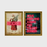 Set of 2 framed prints, festive typography and illustration: a vintage Santa illustration with neon "Rejoice!" text; and neon "Jesus, Mary and Joseph and the Wee Donkey" text over a snowy tree scene — unframed