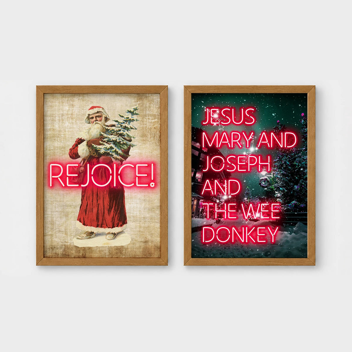 Set of 2 framed prints, festive typography and illustration: a vintage Santa illustration with neon "Rejoice!" text; and neon "Jesus, Mary and Joseph and the Wee Donkey" text over a snowy tree scene — unframed