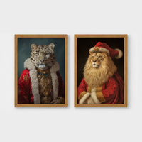 Set of 2 framed prints, animals in festive Christmas dress: a snow leopard in a festive red and gold robe; and a lion in a full Santa outfit — unframed