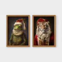 Set of 2 framed prints, animals in festive Christmas dress: a frog in a green festive outfit with a Santa-style hat; and a tiger with a Santa hat and white beard — unframed