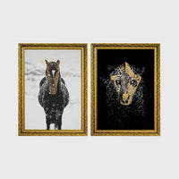 Set of 2 framed prints, animals with gold-painted highlights: a black and white horse in snow with gold-painted highlights; and a black leopard portrait with gold facial markings on black — unframed