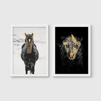 Set of 2 framed prints, animals with gold-painted highlights: a black and white horse in snow with gold-painted highlights; and a black leopard portrait with gold facial markings on black — unframed