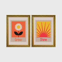 Set of 2 framed prints, stamp-style icon illustrations: a "Grow" stamp-style icon illustration of a flower; and a "Shine" stamp-style icon illustration of a sun — unframed