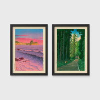 Set of 2 framed prints, Kawase Hasui Japanese woodblock prints: a pink sunset over ocean waves and cliffs; and a cedar forest path with a lone walker — unframed