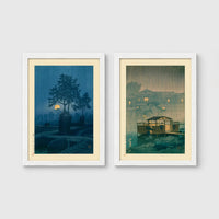 Set of 2 framed prints, Kawase Hasui Japanese woodblock prints (night scenes): a moonlit tree and stone lantern at night; and a misty rain-soaked house with lantern light at dusk — unframed