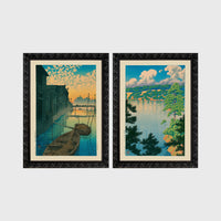 Set of 2 framed prints, Kawase Hasui Japanese woodblock prints: boats moored on a canal at dawn beneath a cloud-streaked sky; and a lake view framed by pine branches beneath drifting clouds — unframed