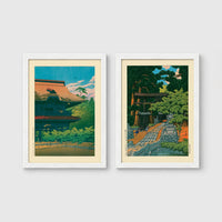 Set of 2 framed prints, Kawase Hasui Japanese woodblock prints: a temple building with a red roof against a blue sky; and a temple approach path with figures beneath trees — unframed