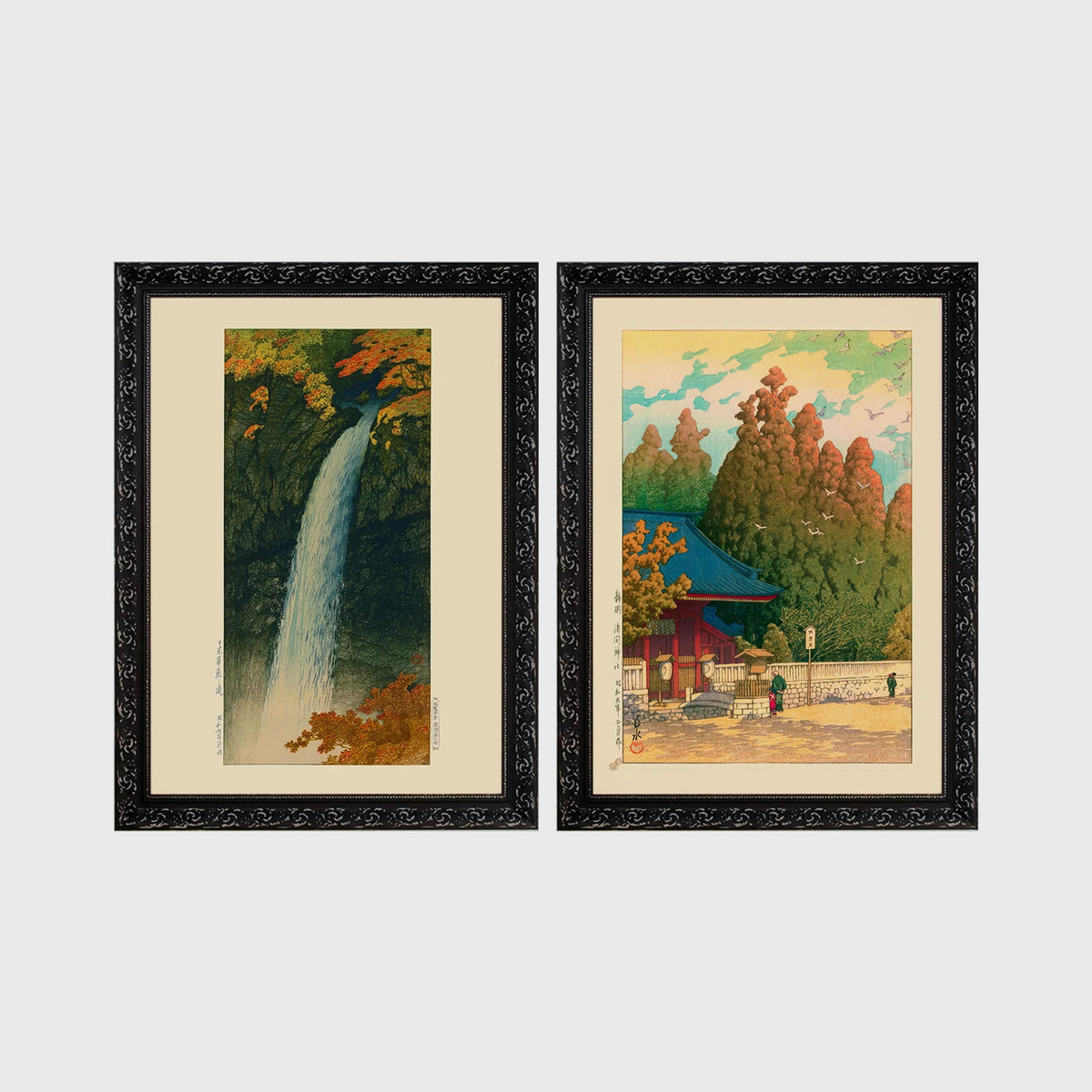 Set of 2 framed prints, Kawase Hasui Japanese woodblock prints: a waterfall cascading through autumn foliage; and a red pagoda gate in an autumn forest — unframed