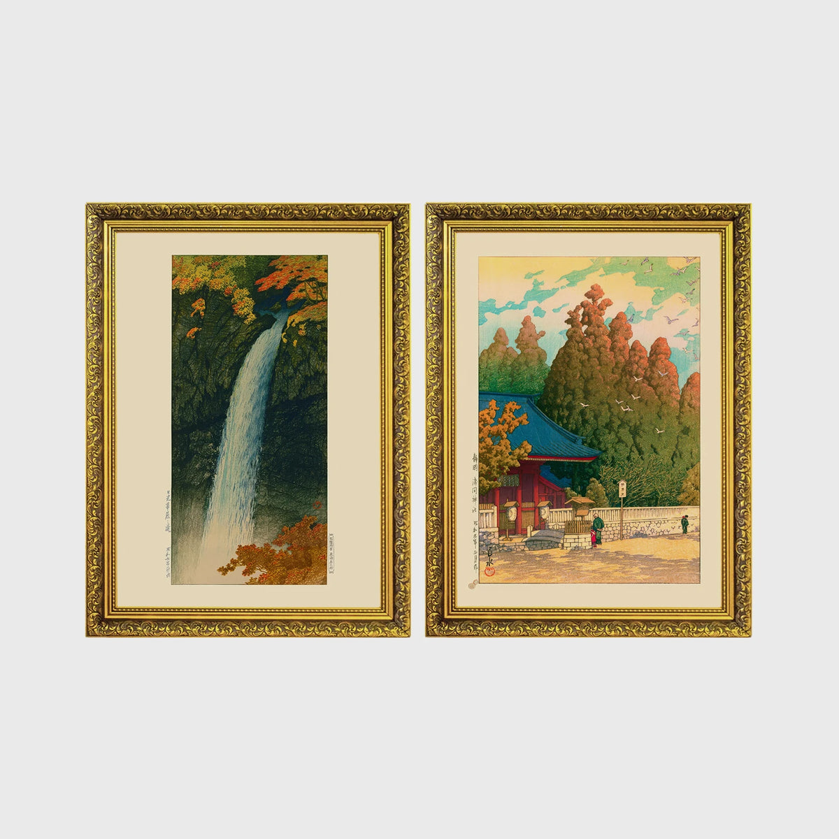 Set of 2 framed prints, Kawase Hasui Japanese woodblock prints: a waterfall cascading through autumn foliage; and a red pagoda gate in an autumn forest — unframed
