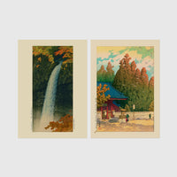 Set of 2 framed prints, Kawase Hasui Japanese woodblock prints: a waterfall cascading through autumn foliage; and a red pagoda gate in an autumn forest — unframed
