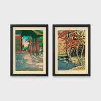 Set of 2 framed prints, Kawase Hasui Japanese woodblock prints: a red temple gate and pavilion with a figure; and a stream through autumn foliage — unframed