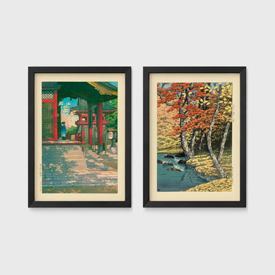 Set of 2 framed prints, Kawase Hasui Japanese woodblock prints: a red temple gate and pavilion with a figure; and a stream through autumn foliage — unframed