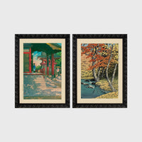 Set of 2 framed prints, Kawase Hasui Japanese woodblock prints: a red temple gate and pavilion with a figure; and a stream through autumn foliage — unframed