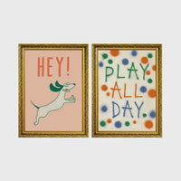 Set of 2 framed prints, playful kids' illustrations: a "Hey!" illustration of a leaping dachshund; and a "Play All Day" polka-dot typography print — unframed