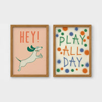 Set of 2 framed prints, playful kids' illustrations: a "Hey!" illustration of a leaping dachshund; and a "Play All Day" polka-dot typography print — unframed