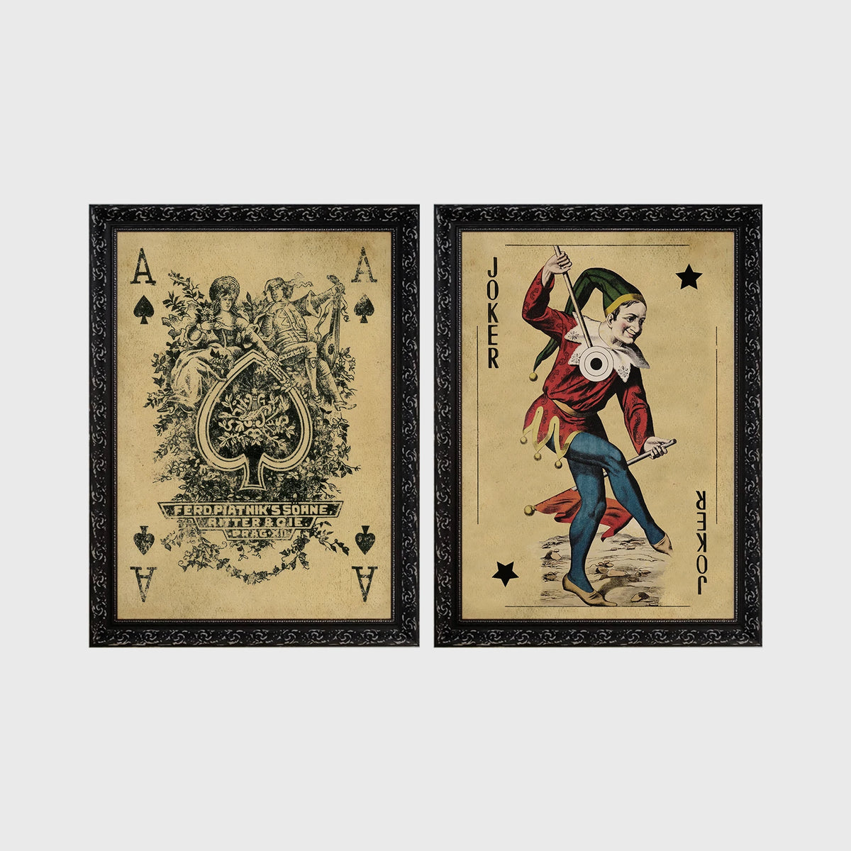 Set of 2 framed prints, vintage oversized playing cards: an ornate Ace of Spades; and a Joker — unframed