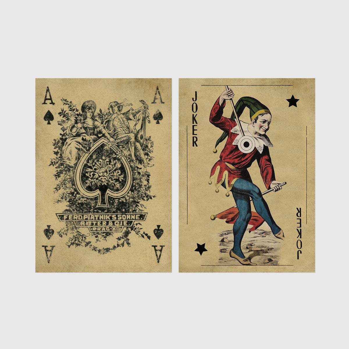Set of 2 framed prints, vintage oversized playing cards: an ornate Ace of Spades; and a Joker — unframed