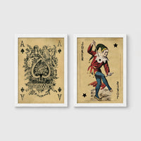 Set of 2 framed prints, vintage oversized playing cards: an ornate Ace of Spades; and a Joker — unframed