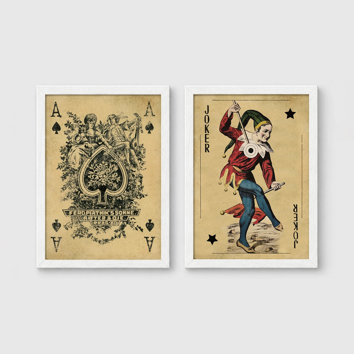 Set of 2 framed prints, vintage oversized playing cards: an ornate Ace of Spades; and a Joker — unframed