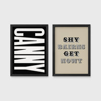 Set of 2 framed prints, Newcastle & Geordie dialect prints (black & white): the word "Canny" in bold black and white type; and the Geordie slogan "Shy Bairns Get Nowt" in bold black and white type — unframed