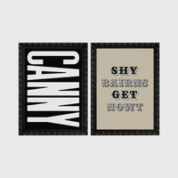 Set of 2 framed prints, Newcastle & Geordie dialect prints (black & white): the word "Canny" in bold black and white type; and the Geordie slogan "Shy Bairns Get Nowt" in bold black and white type — unframed