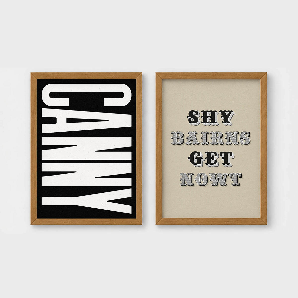 Set of 2 framed prints, Newcastle & Geordie dialect prints (black & white): the word "Canny" in bold black and white type; and the Geordie slogan "Shy Bairns Get Nowt" in bold black and white type — unframed