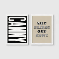 Set of 2 framed prints, Newcastle & Geordie dialect prints (black & white): the word "Canny" in bold black and white type; and the Geordie slogan "Shy Bairns Get Nowt" in bold black and white type — unframed