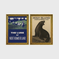 Set of 2 framed prints, vintage Northumberland travel posters: a "The Lure of Northumberland" poster of riders at night; and a "Holy Island Northumberland" poster featuring a seal — unframed
