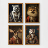 Set of 4 framed prints, animals in period noble dress: a snow leopard in a blue royal robe; a crowned Pomeranian in royal dress; a moose in a red velvet military collar; and an otter in a floral jacket — unframed