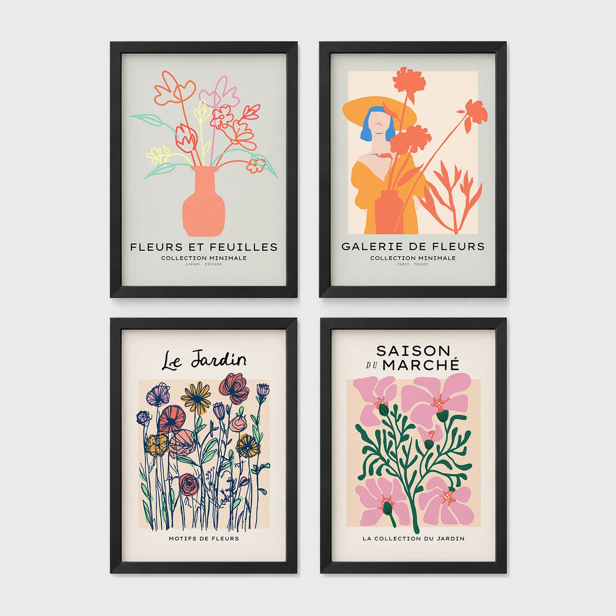 Set of 4 framed prints, pop art and vintage-poster mix: a Warhol-style pop art skull in orange on blue; an "L'atelier des Fleurs" floral botanical poster; a "Welcome To The Freak Show" vintage floral circus poster; and a still life with a skull and jar, overlaid with colourful polka dots — unframed