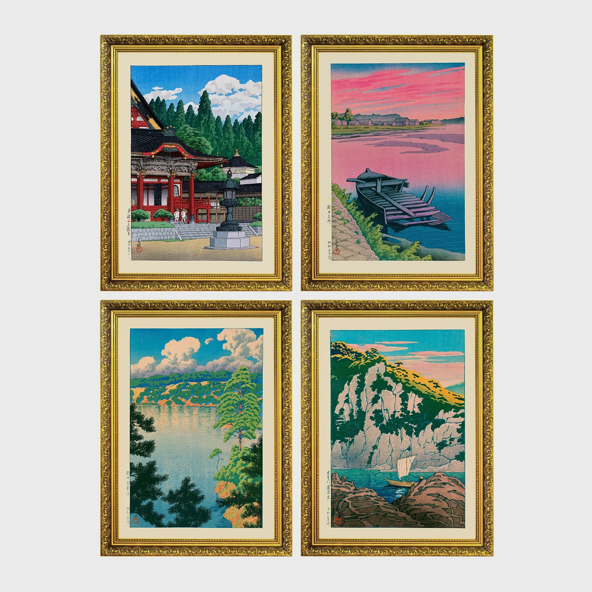 Set of 4 framed prints, Kawase Hasui Japanese woodblock prints: a red shrine framed by pine trees under a blue sky; a pink sunset over a lake with a moored boat; a lake view framed by pine branches beneath drifting clouds; and green coastal cliffs with a waterfall over turquoise water — unframed