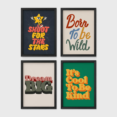 Set of 4 framed prints, retro groovy typographic quote prints: "Shoot For The Stars" typography with a star character; "Born To Be Wild" typography; "Dream Big" typography; and "It's Cool To Be Kind" typography — unframed